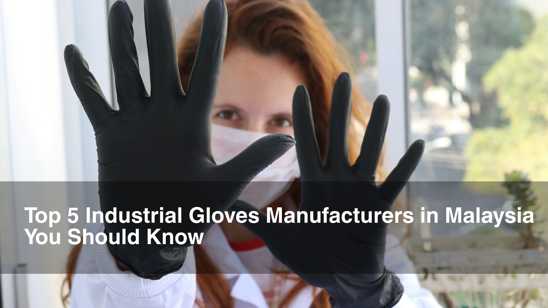 Researcher in Industrial Gloves holding up 10 fingers